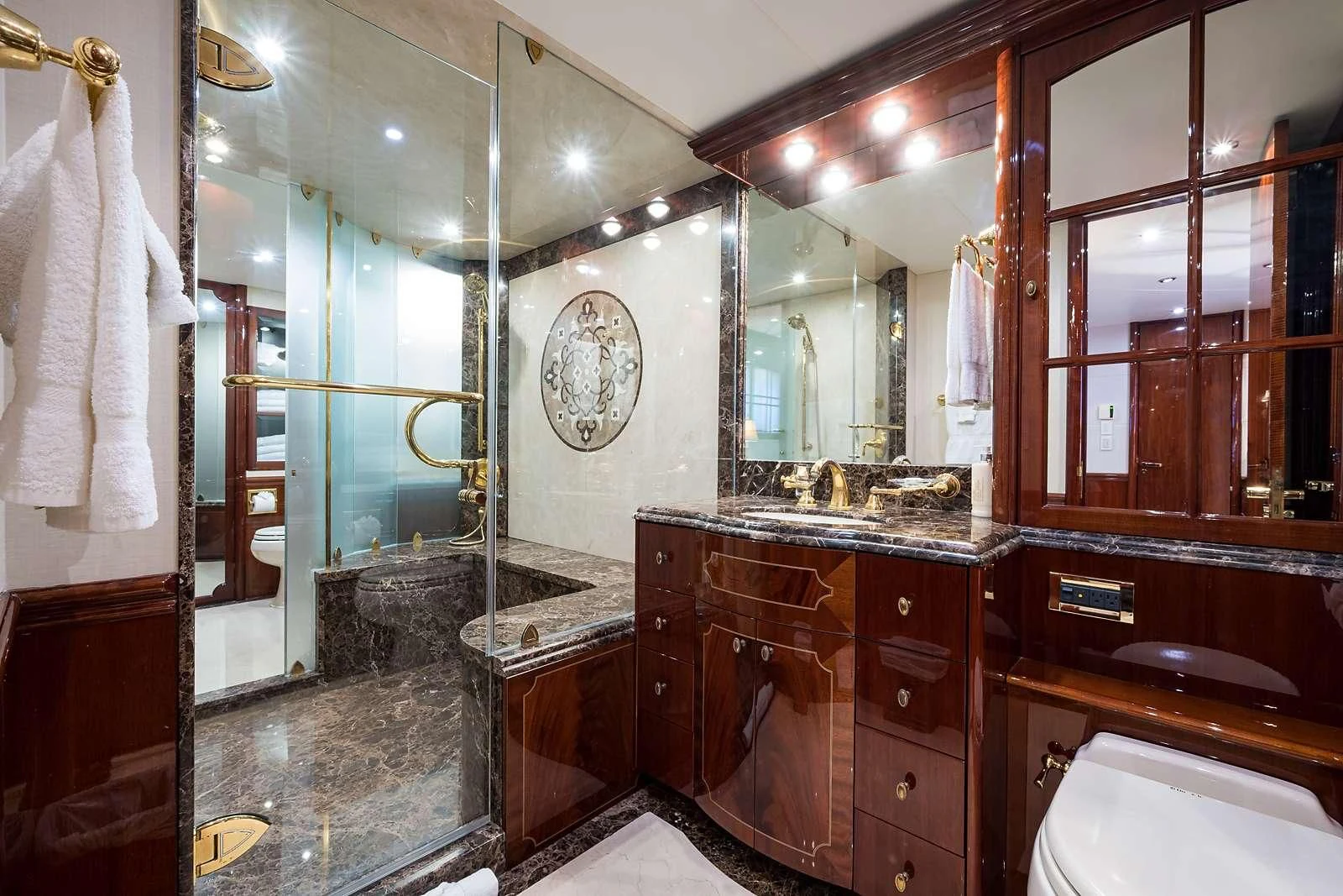 a bathroom with a large mirror aboard LADY KRISTINA Yacht for Sale