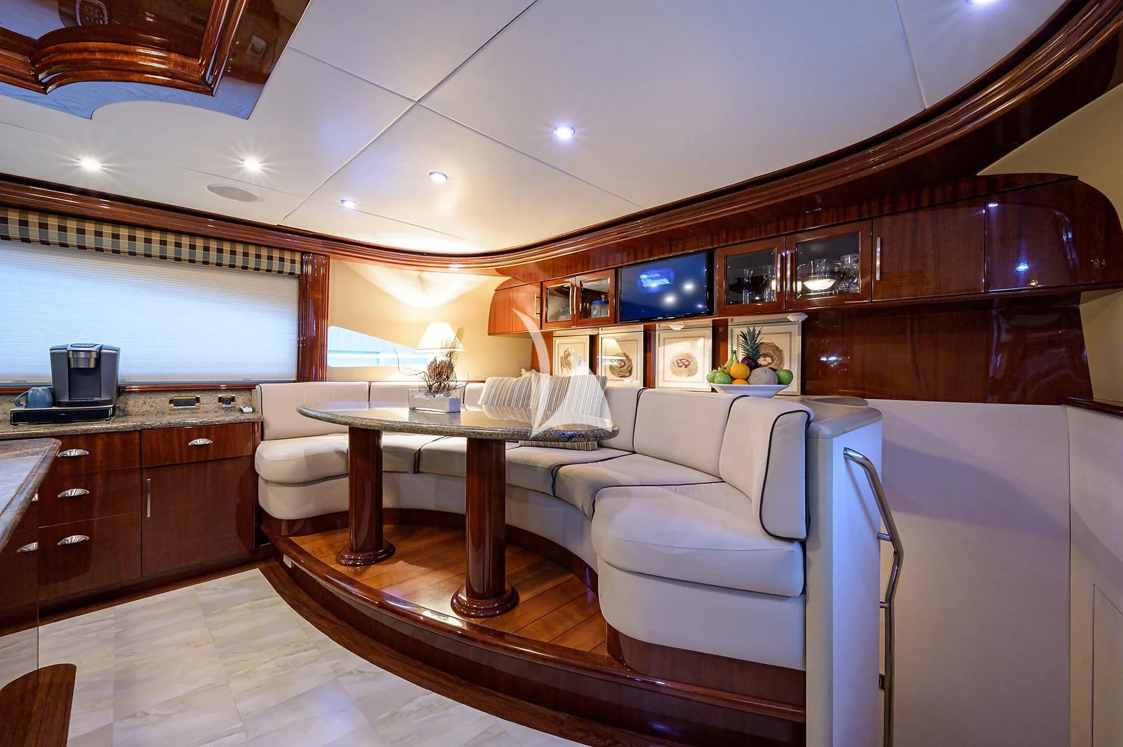 a large living room with a large kitchen and dining area aboard LADY KRISTINA Yacht for Sale