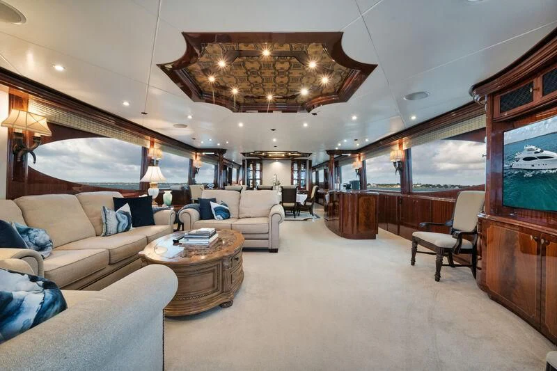a living room with a large chandelier aboard LADY KRISTINA Yacht for Sale