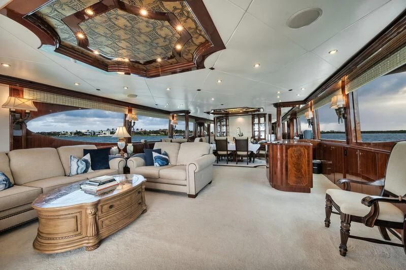 a large living room with a large chandelier aboard LADY KRISTINA Yacht for Sale