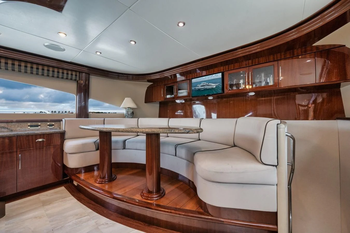 a living room with a couch and a table aboard LADY KRISTINA Yacht for Sale