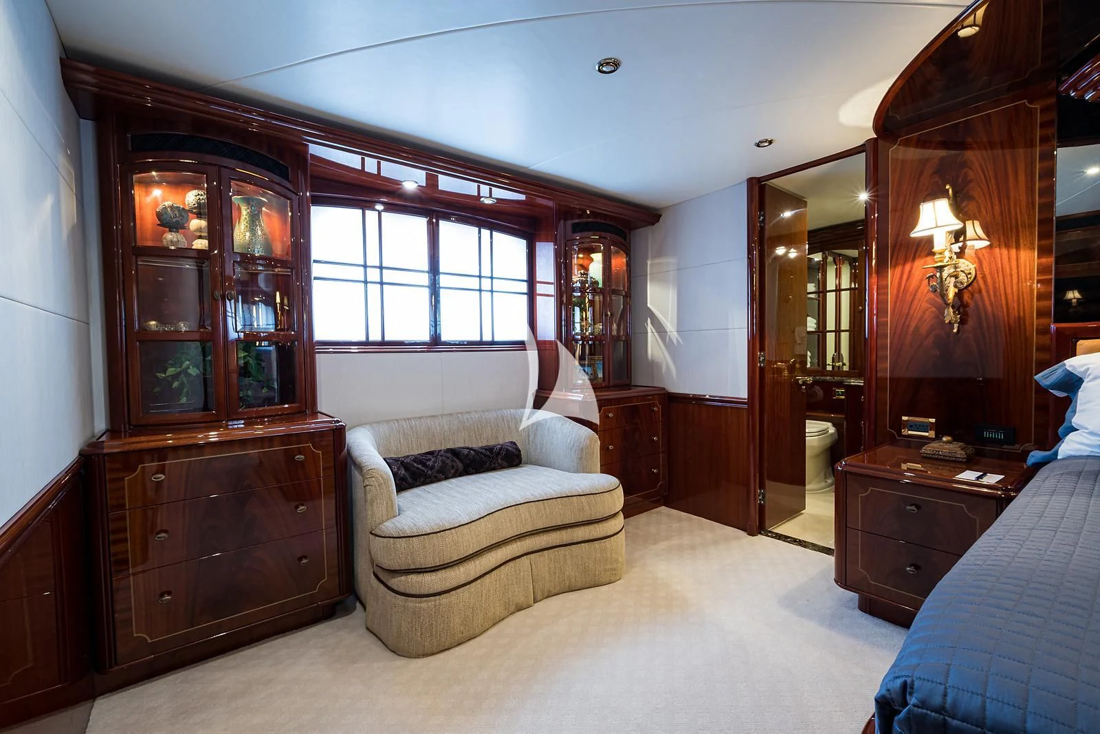 a room with a chair and a bed aboard LADY KRISTINA Yacht for Sale