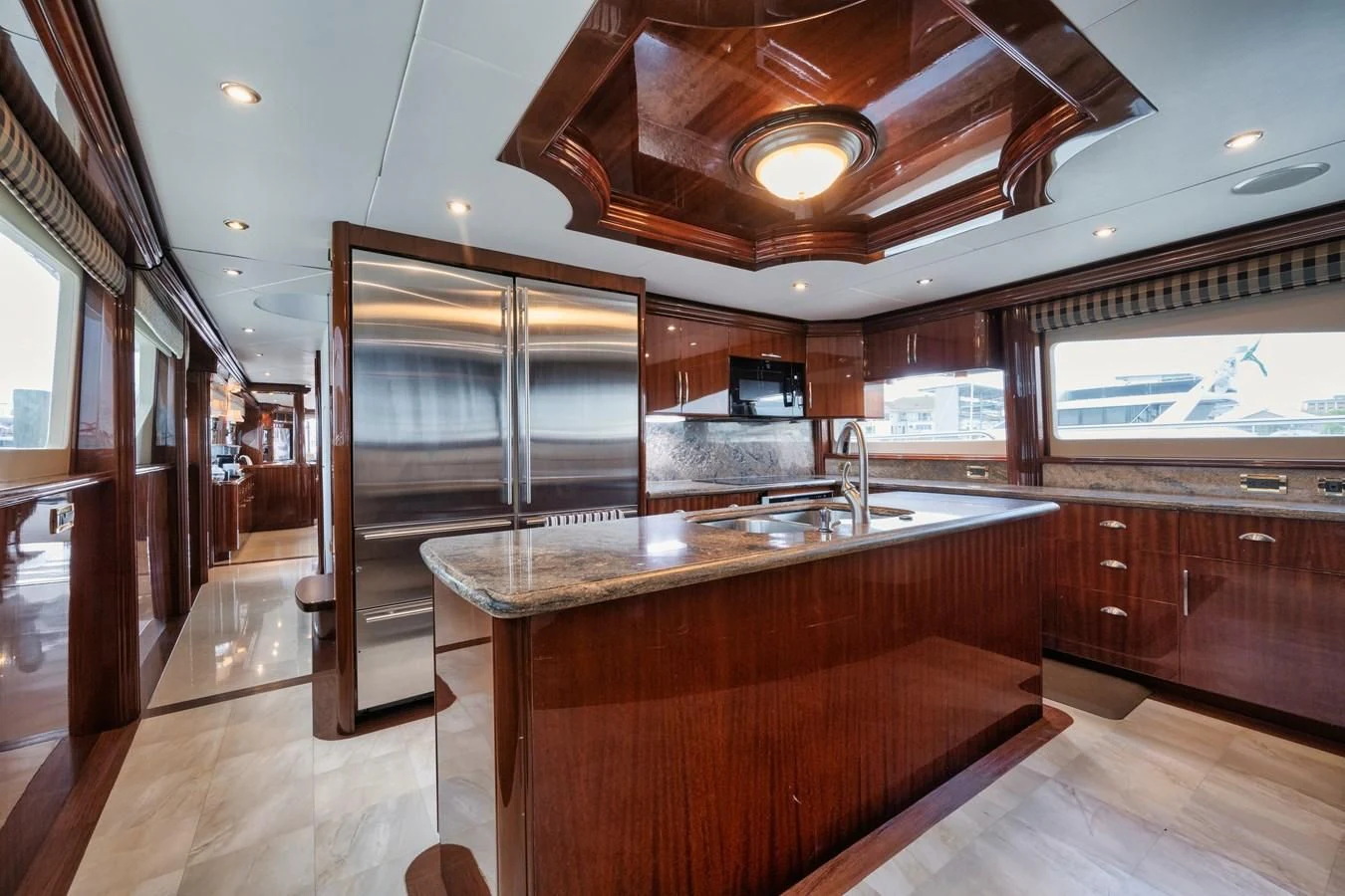 a kitchen with wooden cabinets aboard LADY KRISTINA Yacht for Sale