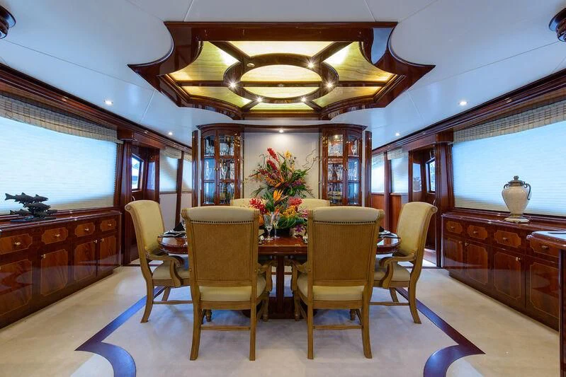 a dining room with a table and chairs aboard LADY KRISTINA Yacht for Sale