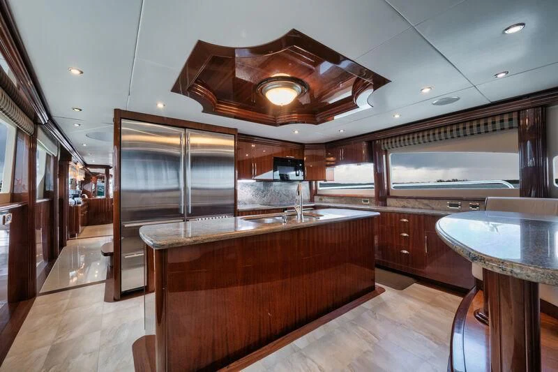 a large kitchen with a bar and bar aboard LADY KRISTINA Yacht for Sale