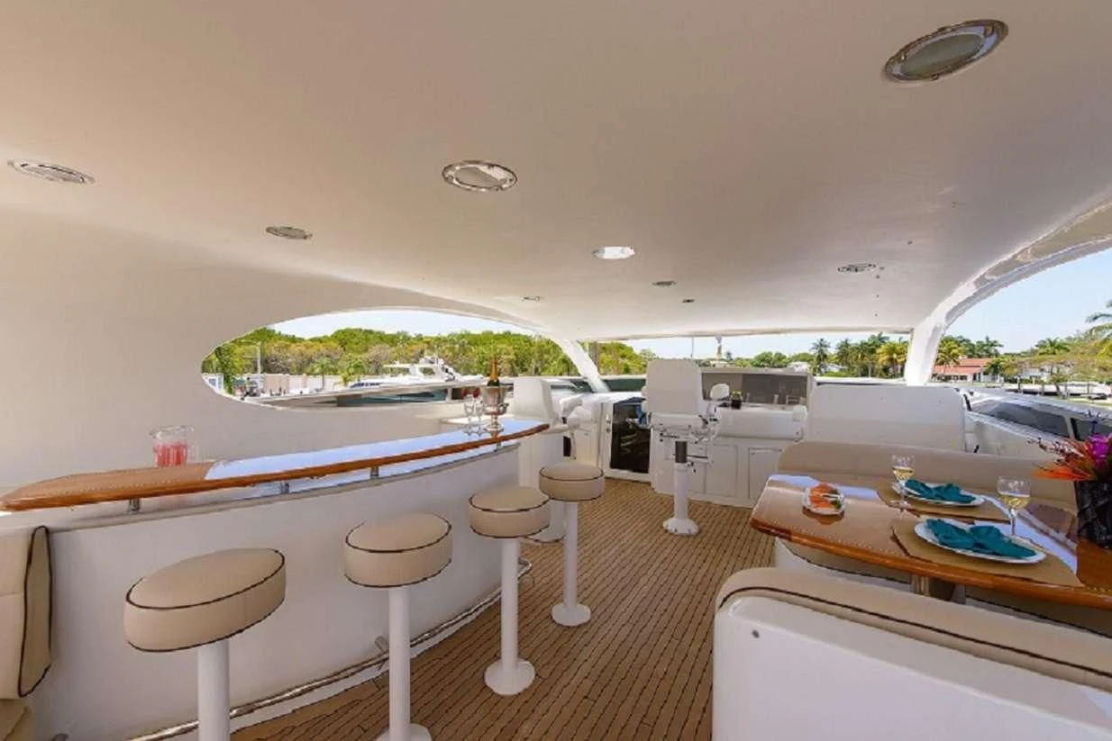 a room with tables and chairs aboard LADY KRISTINA Yacht for Sale