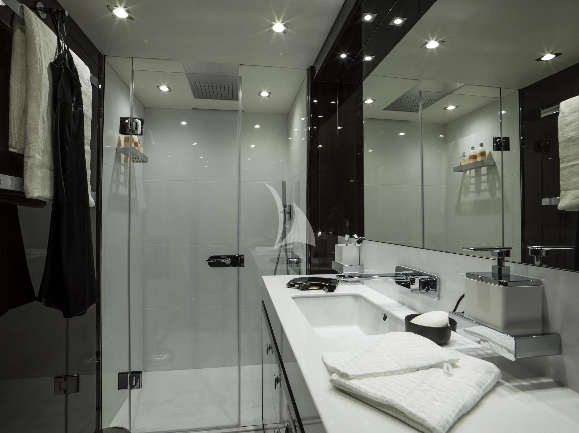 a bathroom with a large mirror aboard FLEUR Yacht for Charter