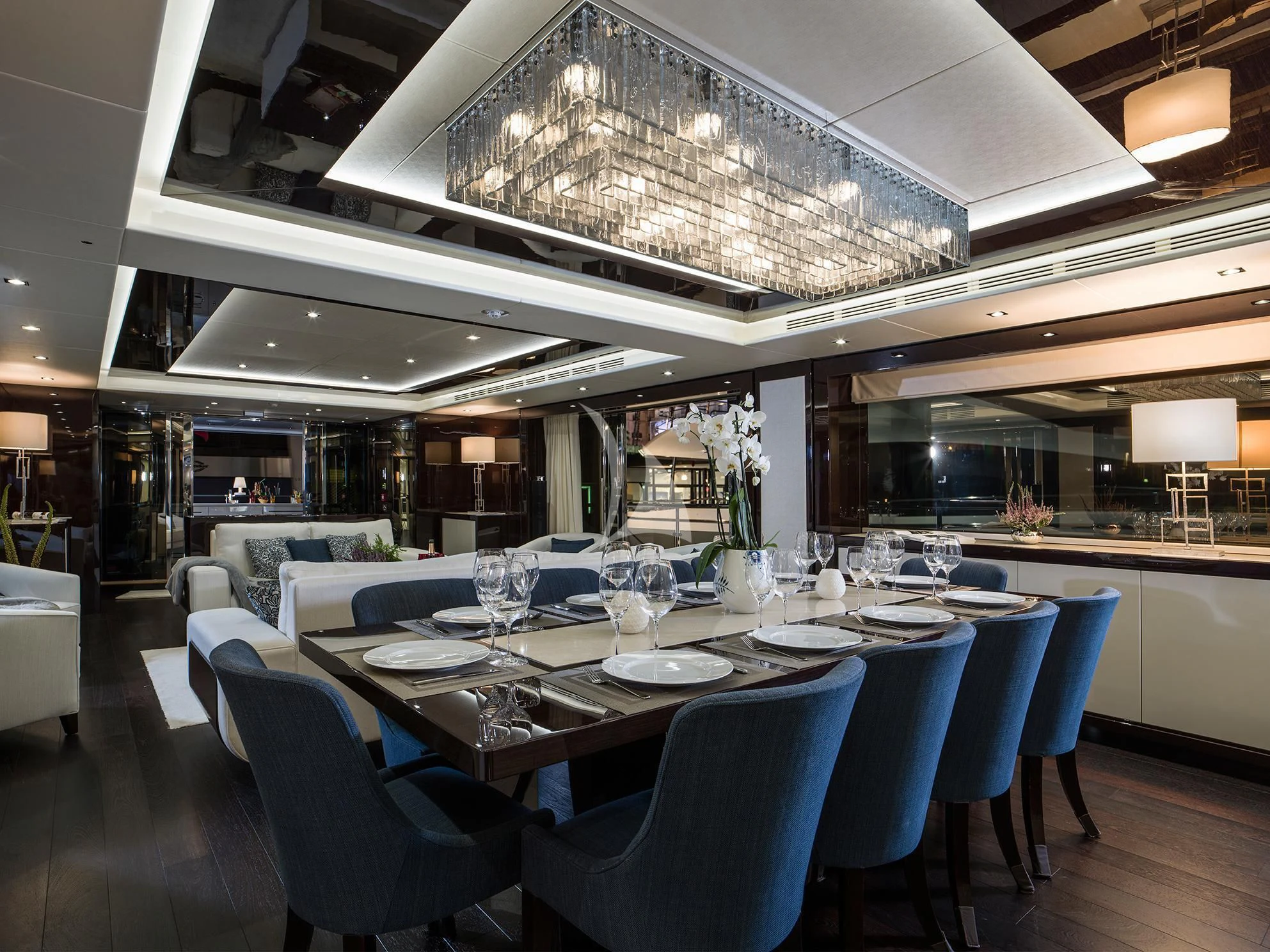 a large room with tables and chairs aboard FLEUR Yacht for Charter