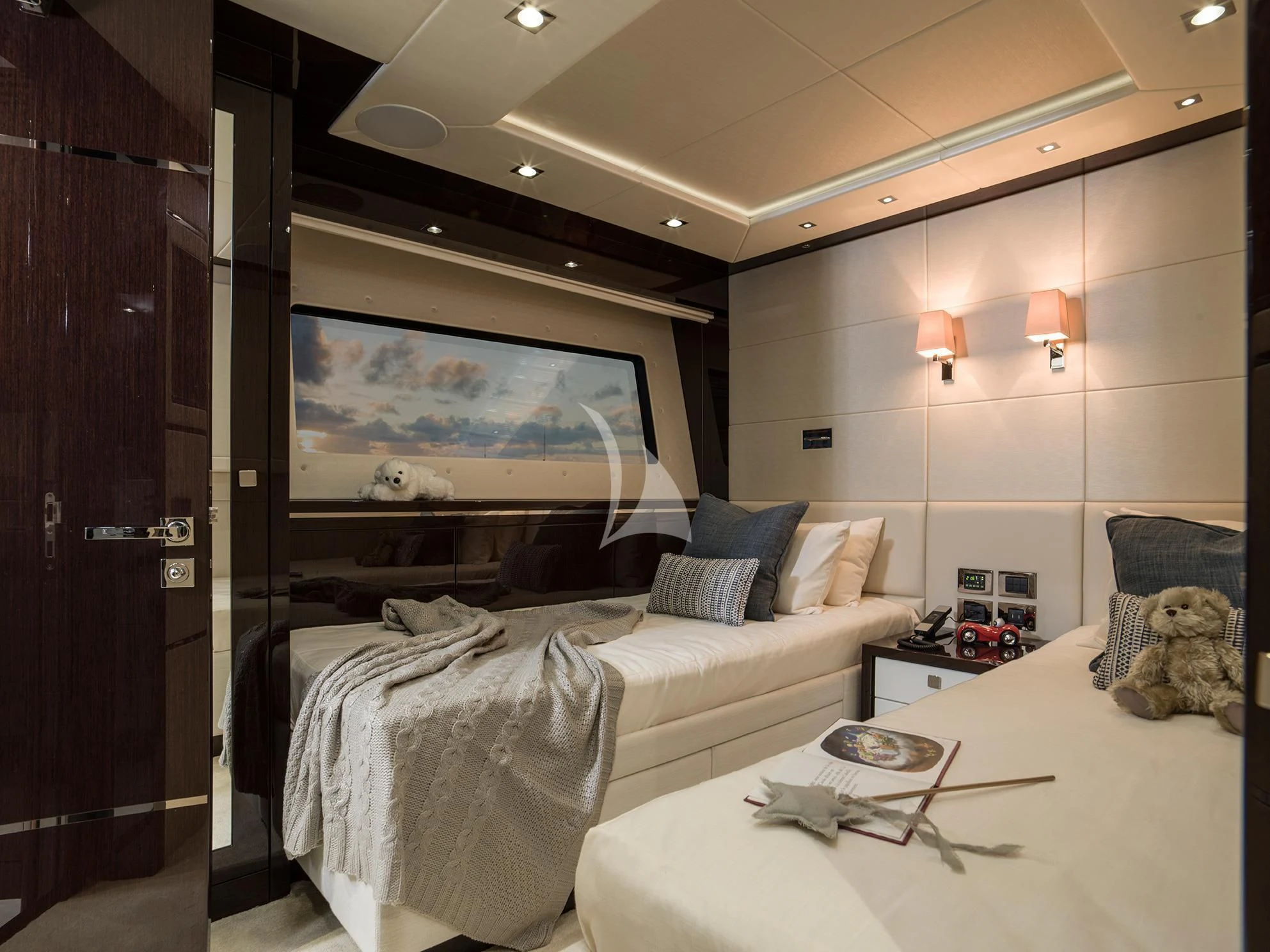 a bedroom with a large screen aboard FLEUR Yacht for Charter