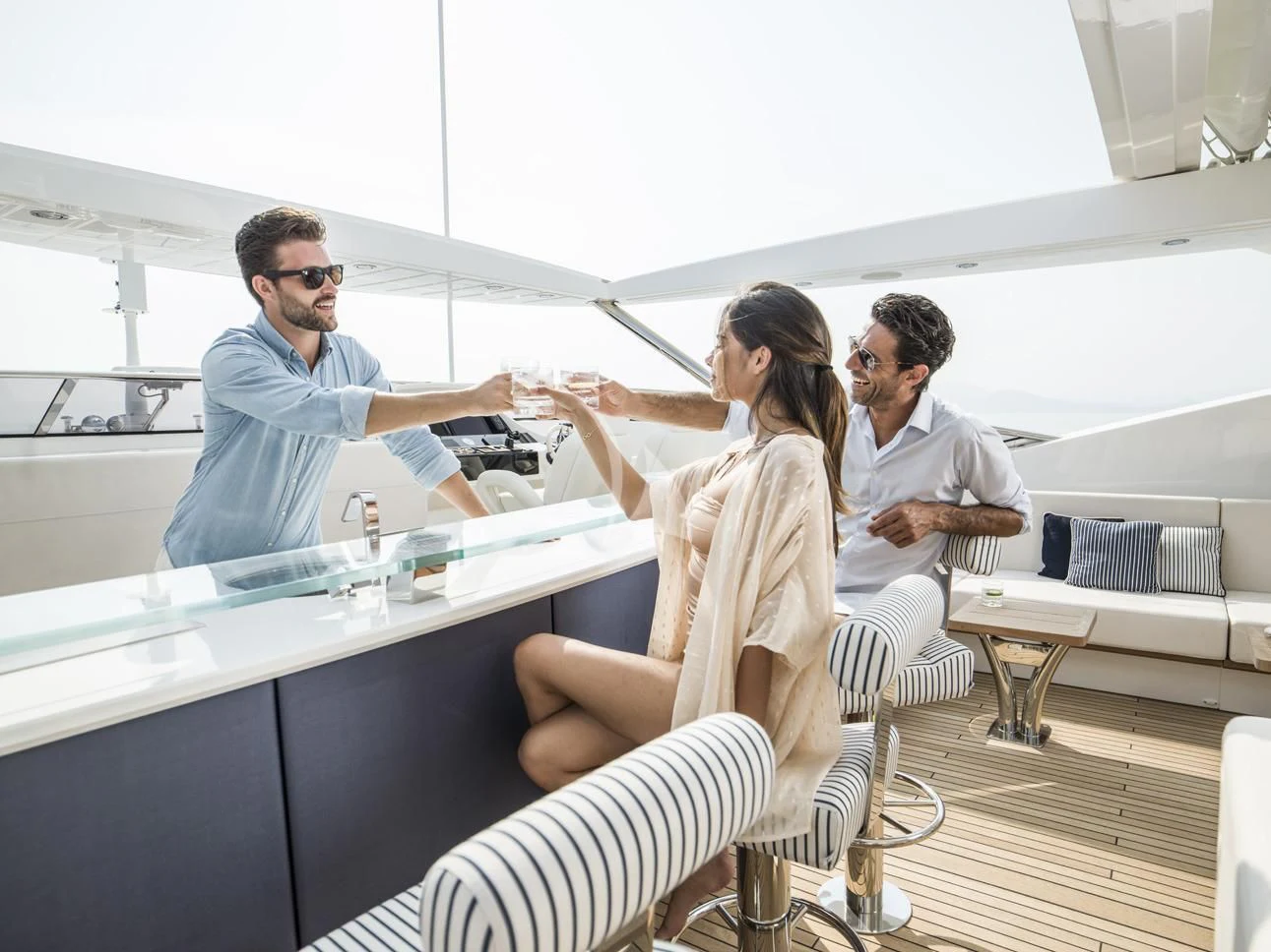 a group of people in a discussion aboard FLEUR Yacht for Charter