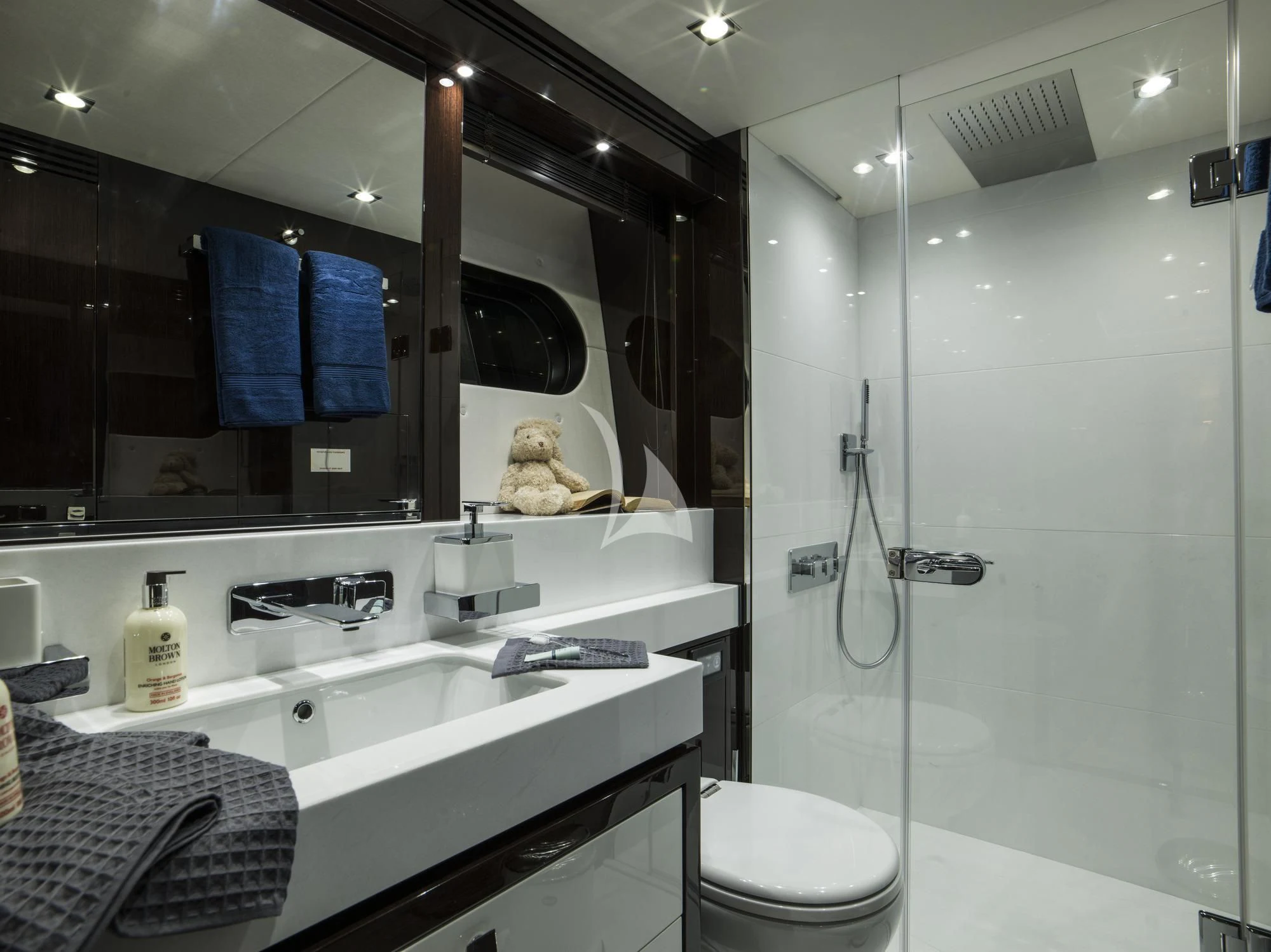a bathroom with a glass shower aboard FLEUR Yacht for Charter