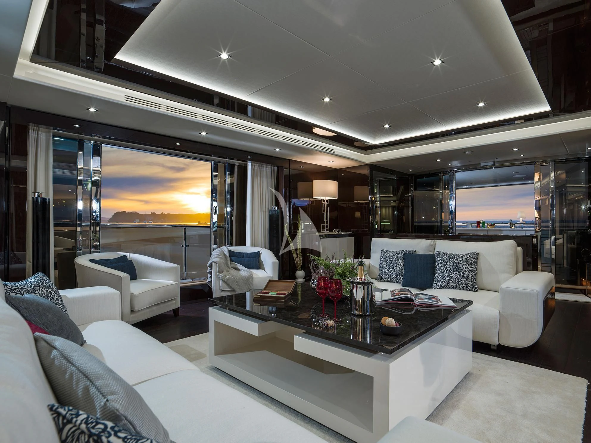 a living room with a large window aboard FLEUR Yacht for Charter