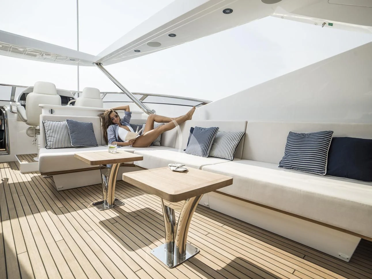 a person lying on a couch aboard FLEUR Yacht for Charter