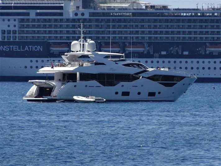 a large white boat in the water aboard FLEUR Yacht for Charter