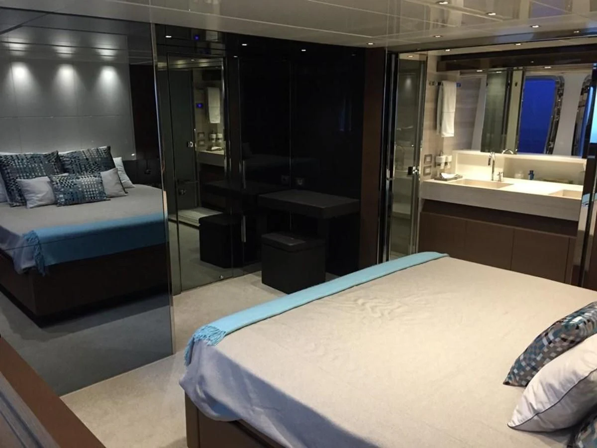a room with a bed and a sink aboard TAIJI Yacht for Sale