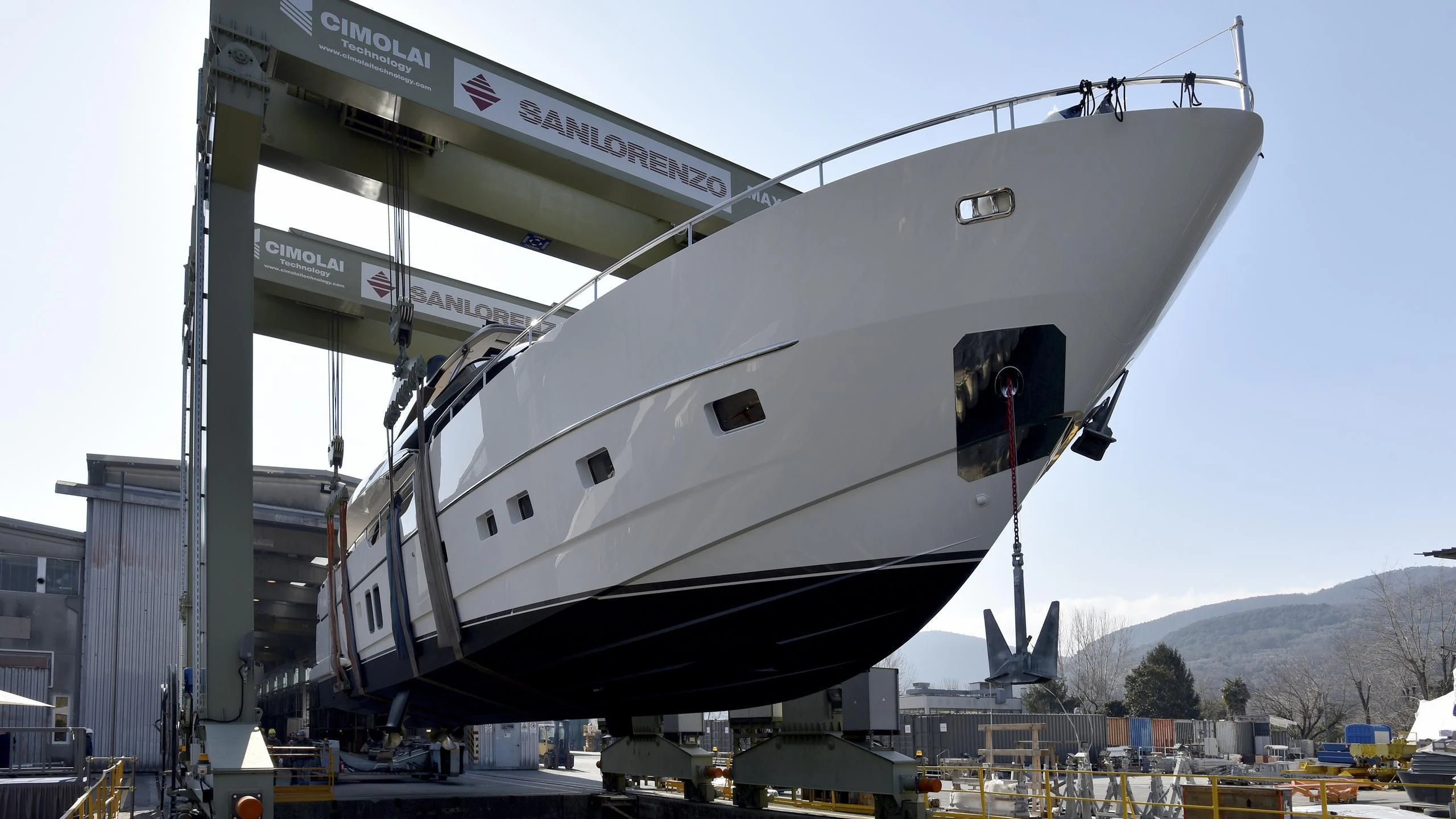 a white boat on a dock aboard TAIJI Yacht for Sale