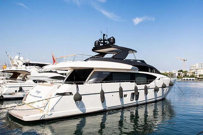 a white yacht in the water aboard TAIJI Yacht for Sale