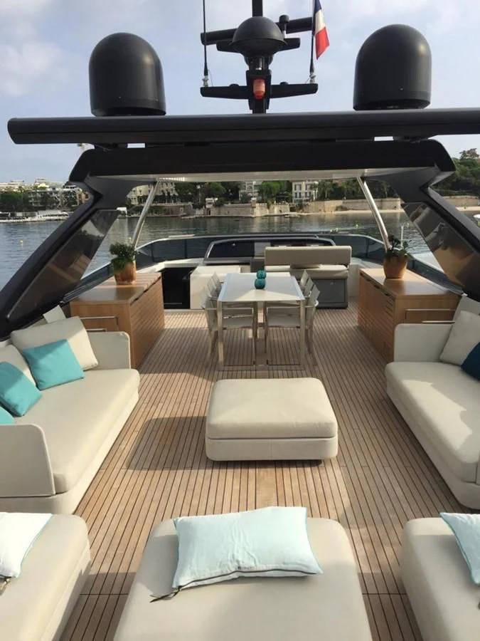 a room with a view of the water and the deck aboard TAIJI Yacht for Sale