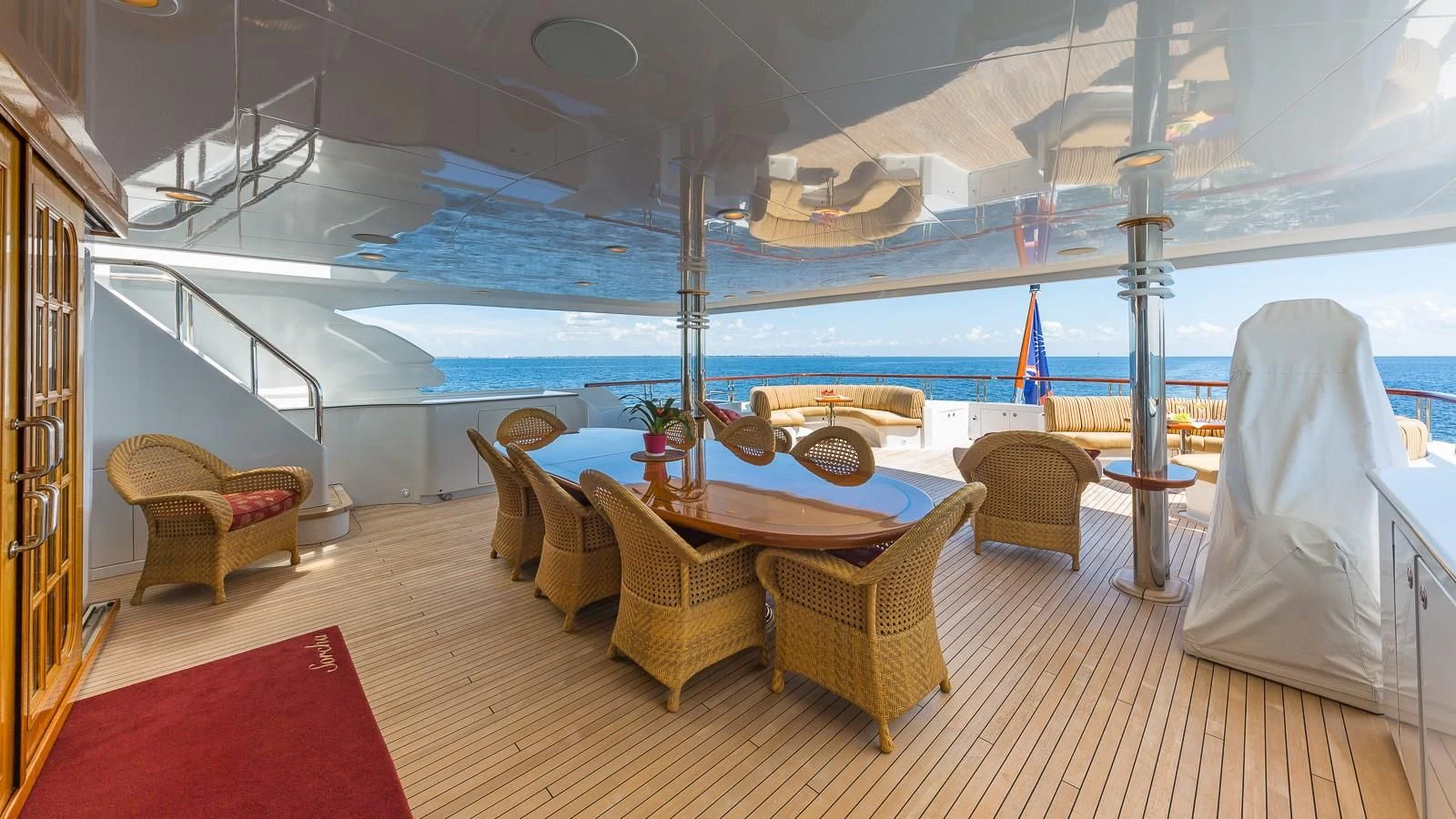 a room with a table chairs and a large window aboard SORCHA Yacht for Sale
