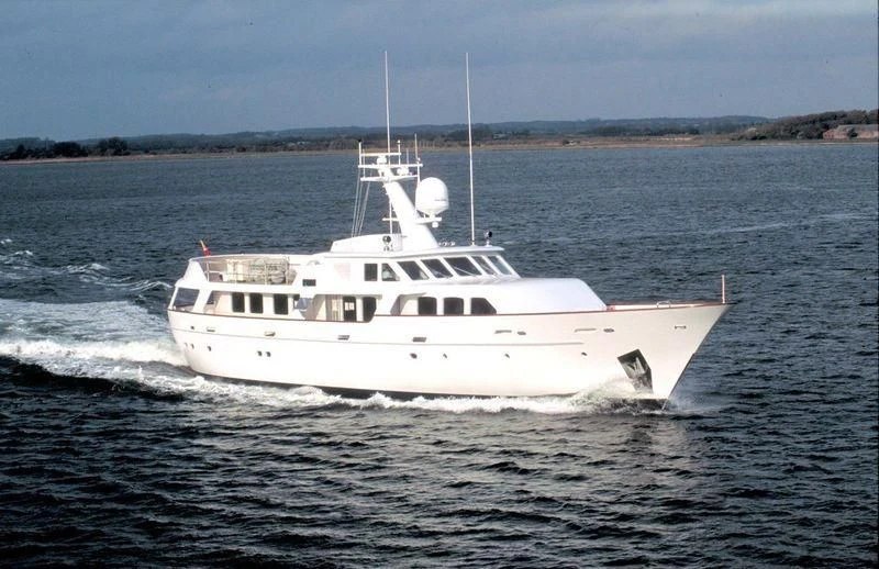 a white yacht in the water aboard HAIMA Yacht for Sale