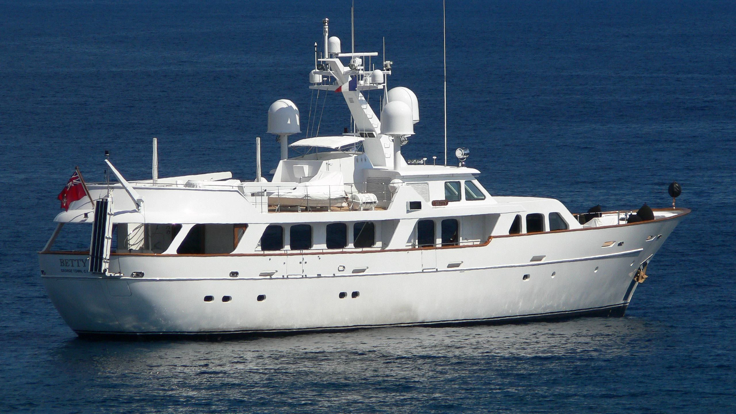 a large white boat in the water aboard HAIMA Yacht for Sale