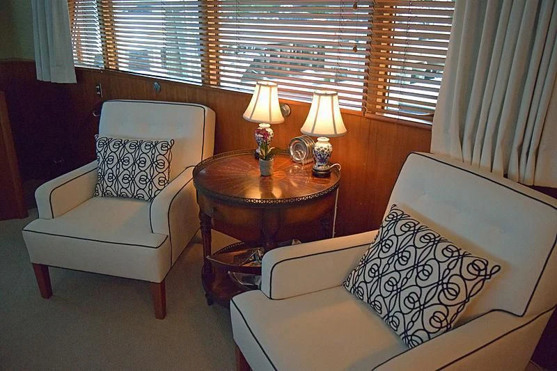 a couple of chairs in a room aboard AURORE Yacht for Sale