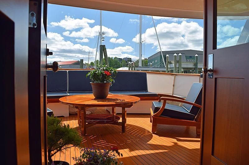 a table and chairs in a room aboard AURORE Yacht for Sale