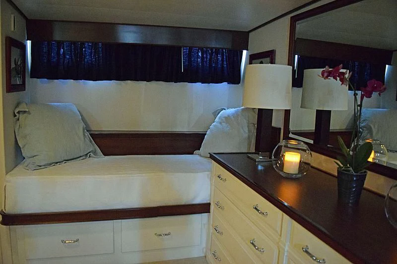 a hotel room with a bed and a desk aboard AURORE Yacht for Sale