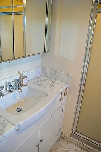 a bathroom with a sink and mirror aboard AURORE Yacht for Sale