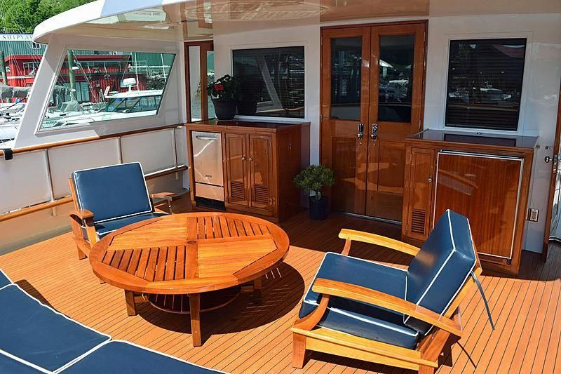 a room with a table and chairs aboard AURORE Yacht for Sale