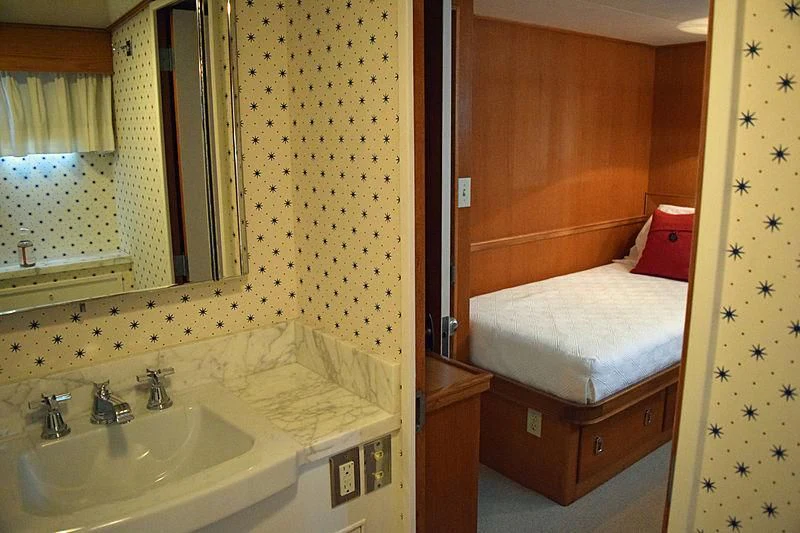 a bathroom with a sink and a mirror aboard AURORE Yacht for Sale