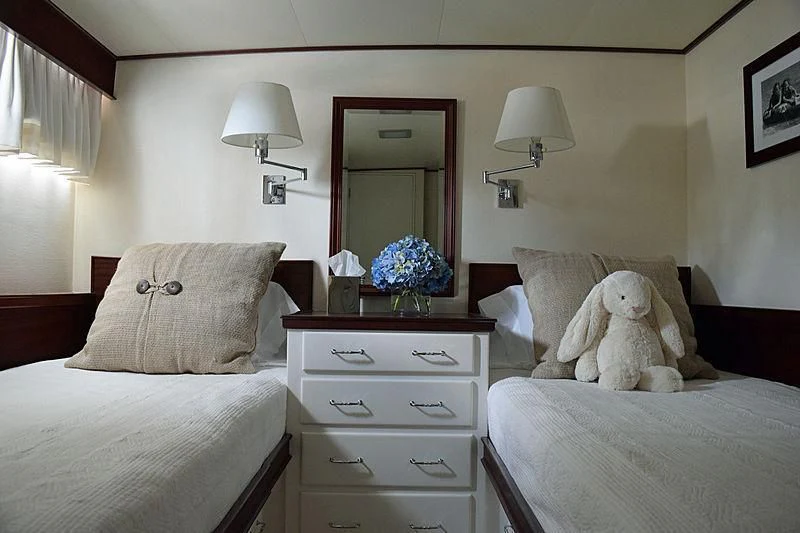 a dog on a bed aboard AURORE Yacht for Sale
