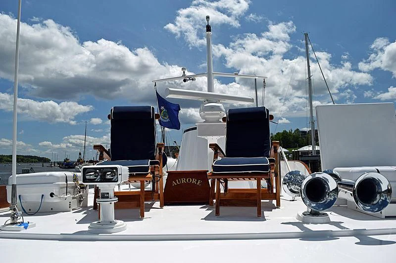 a group of chairs and a table aboard AURORE Yacht for Sale