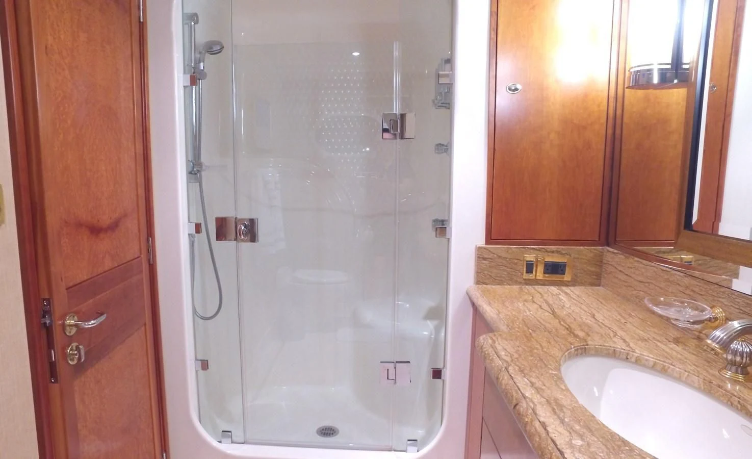 a bathroom with a shower unit and sink aboard ELYSIAN Yacht for Sale
