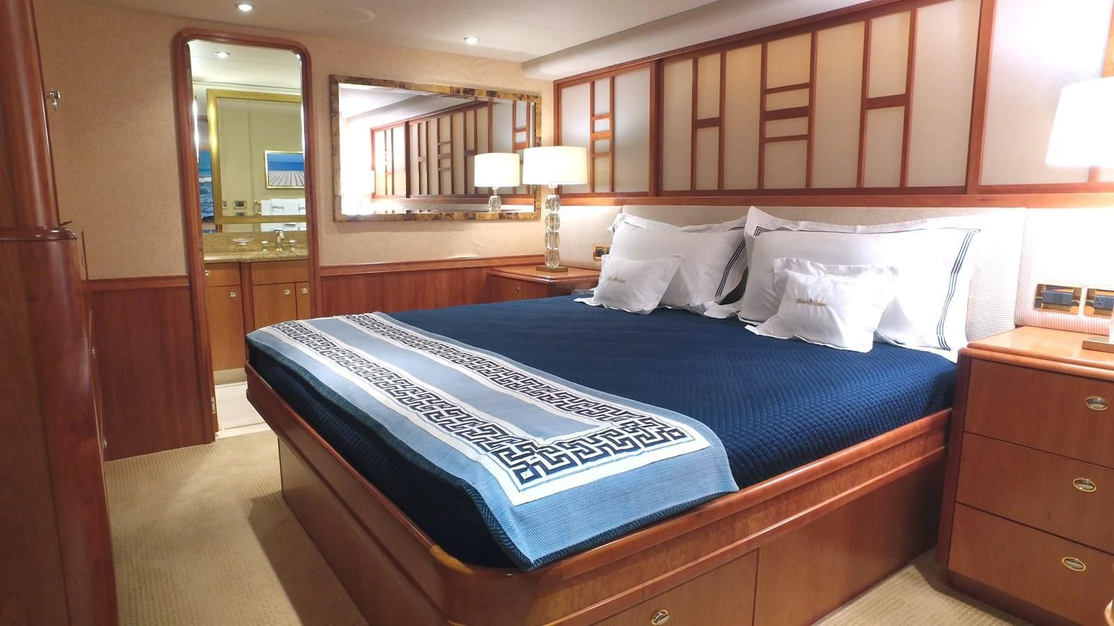 a bed with a blue sheet aboard ELYSIAN Yacht for Sale