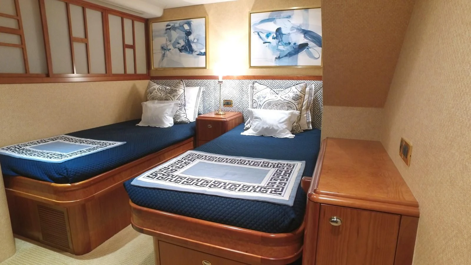 a room with two beds aboard ELYSIAN Yacht for Sale
