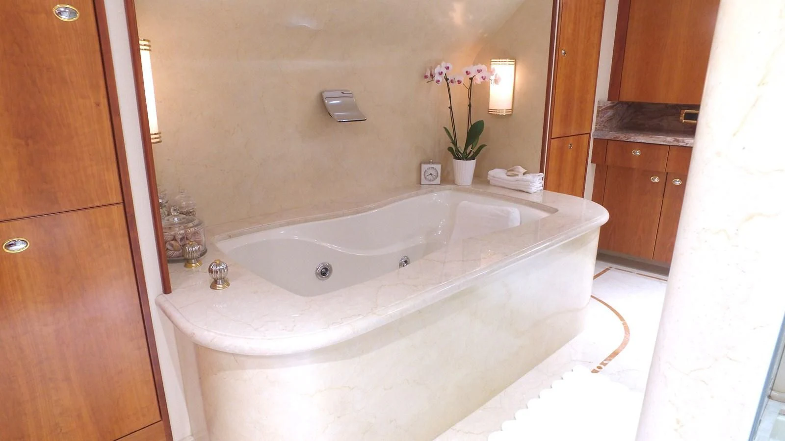 a bathtub with flowers in a bathroom aboard ELYSIAN Yacht for Sale