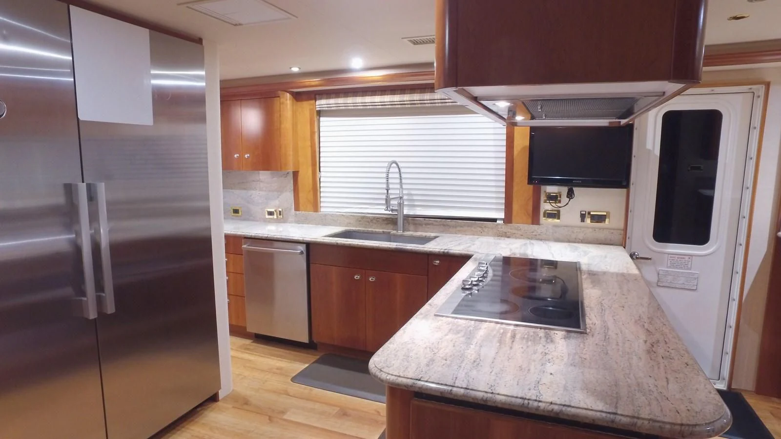 a kitchen with a microwave oven and refrigerator aboard ELYSIAN Yacht for Sale