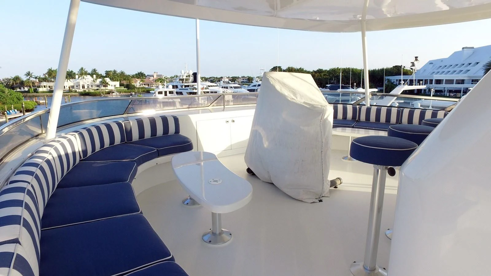 a white chair on a white table aboard ELYSIAN Yacht for Sale
