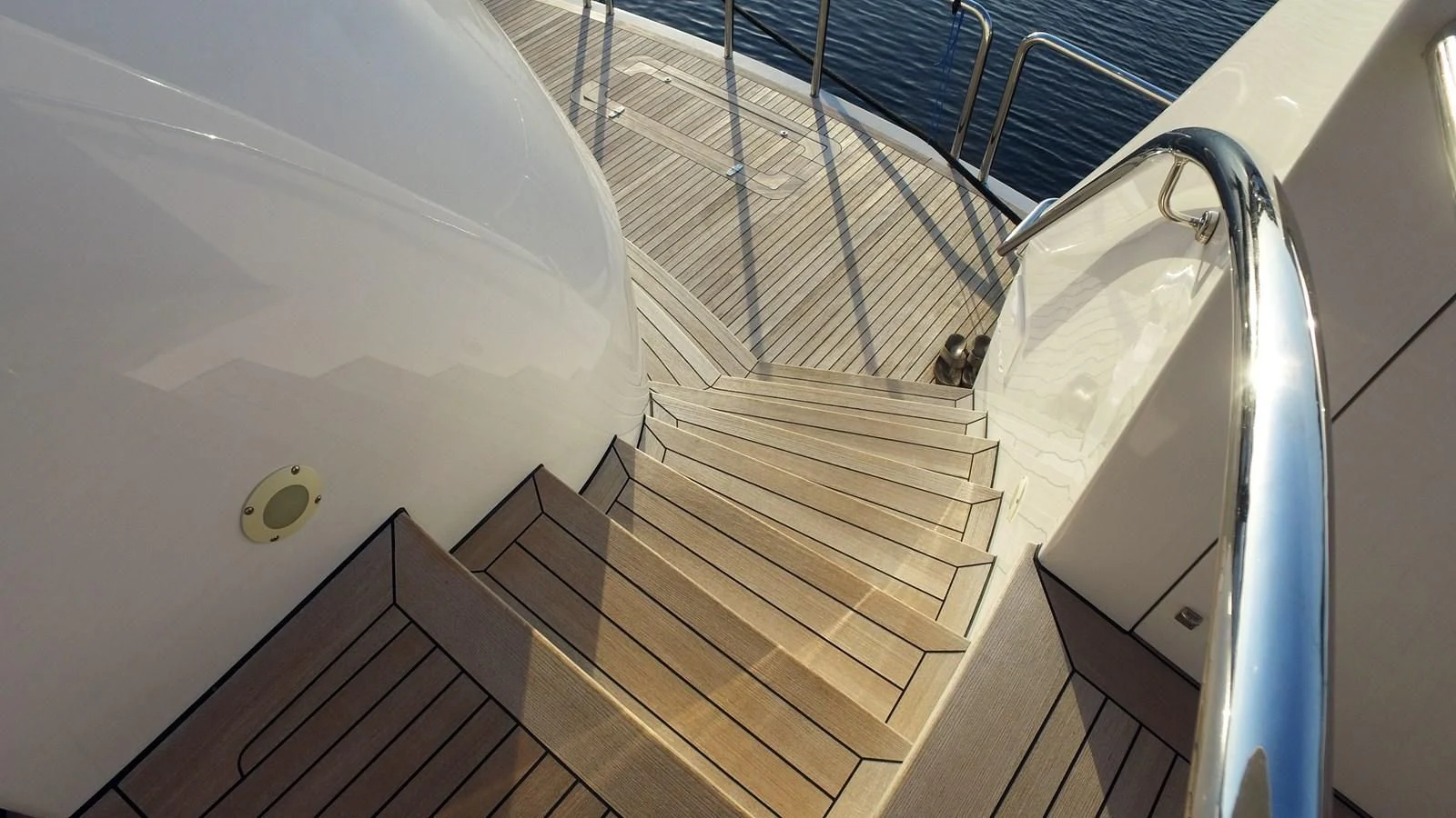 a staircase with a metal railing aboard ELYSIAN Yacht for Sale