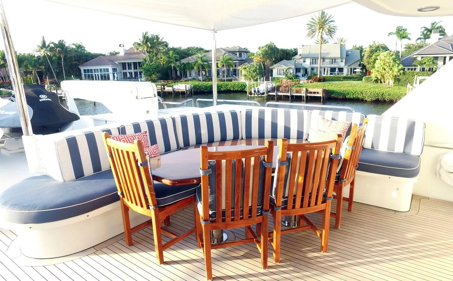 a deck with chairs and tables aboard ELYSIAN Yacht for Sale