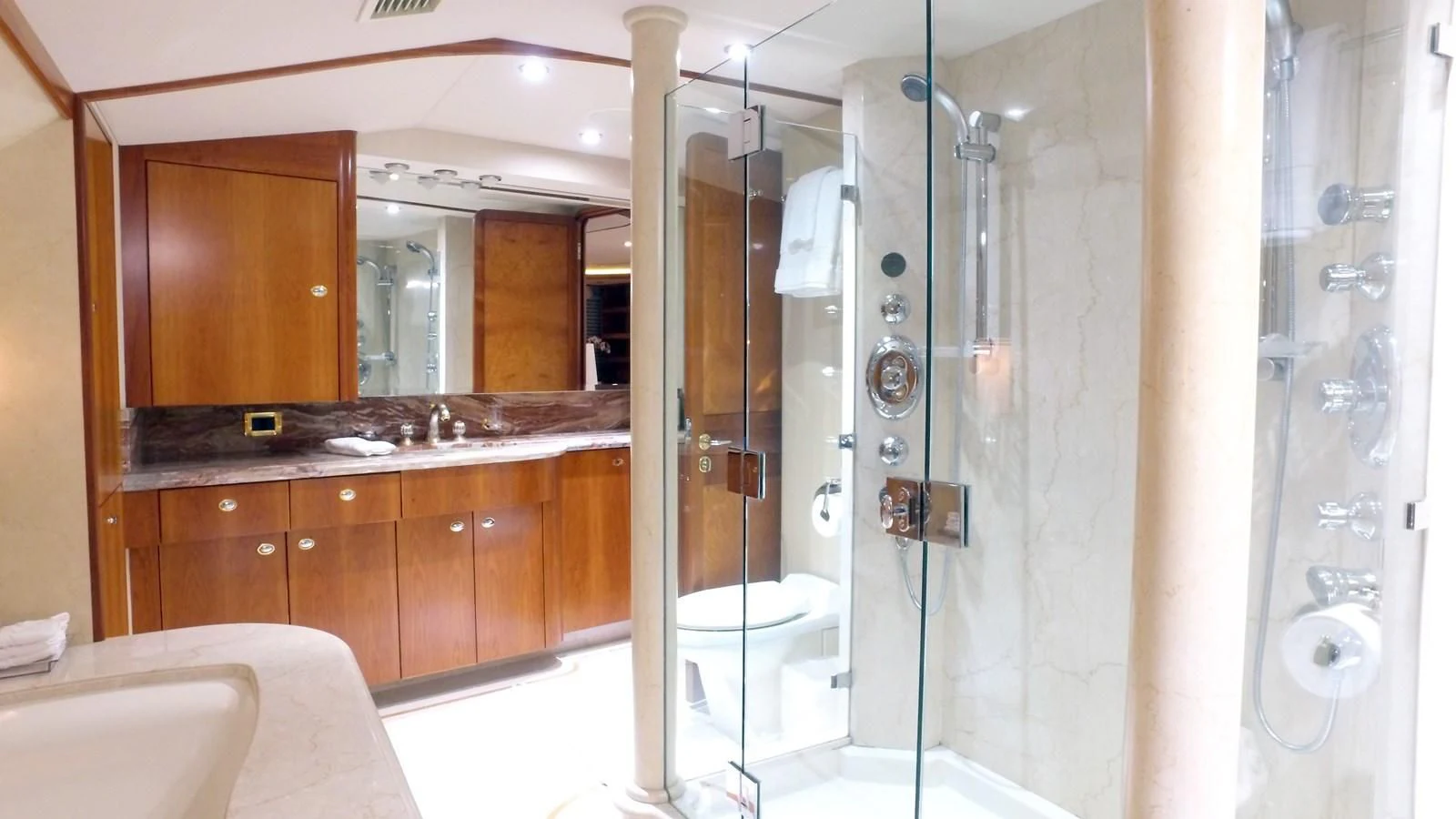 a bathroom with a glass shower aboard ELYSIAN Yacht for Sale