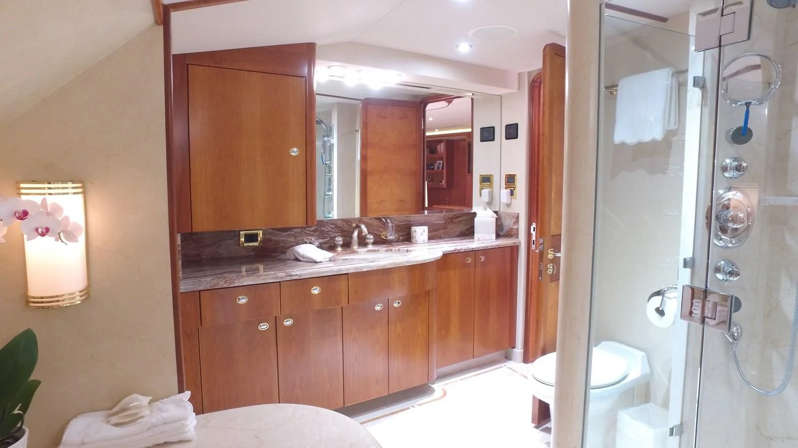 a bathroom with a large mirror aboard ELYSIAN Yacht for Sale