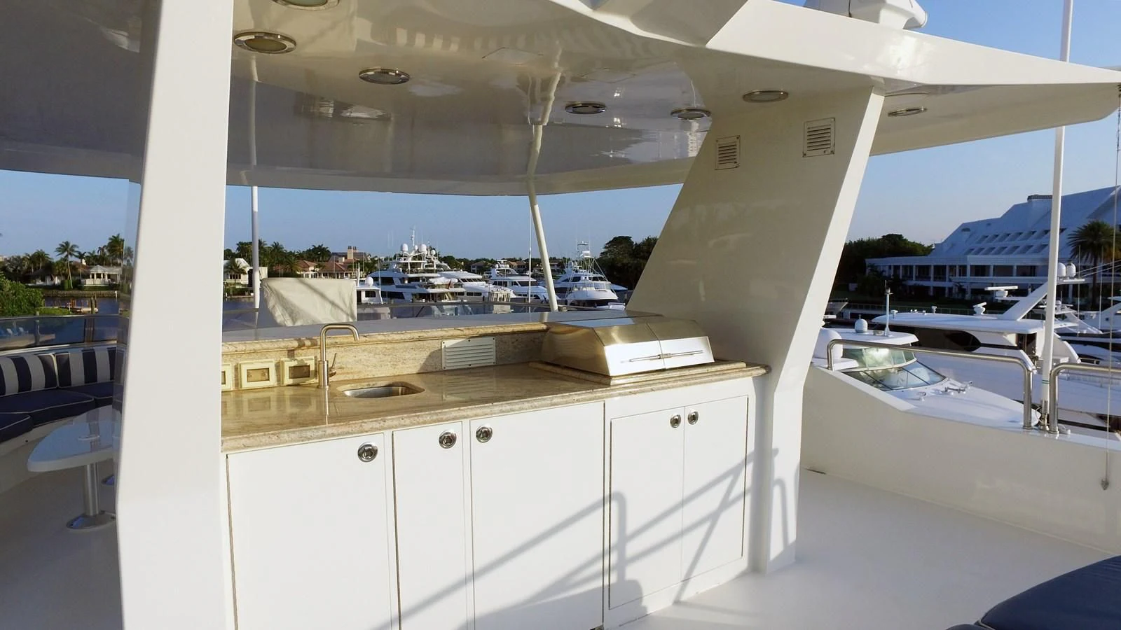 a room with a view of the water and boats aboard ELYSIAN Yacht for Sale
