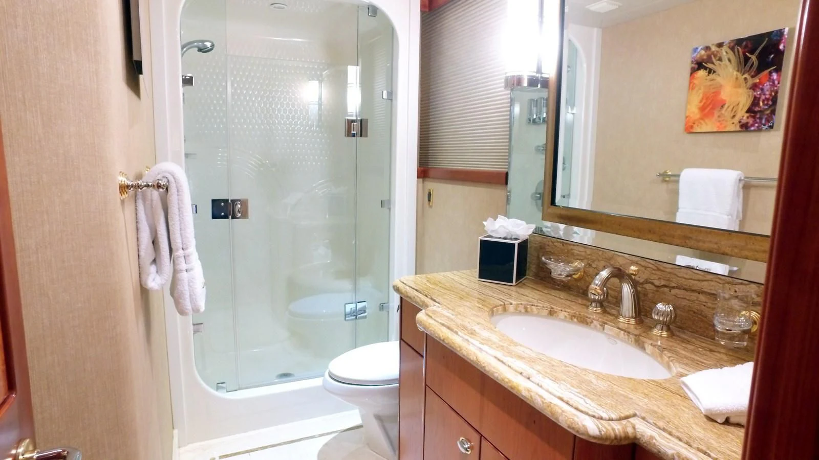 a bathroom with a glass shower door aboard ELYSIAN Yacht for Sale