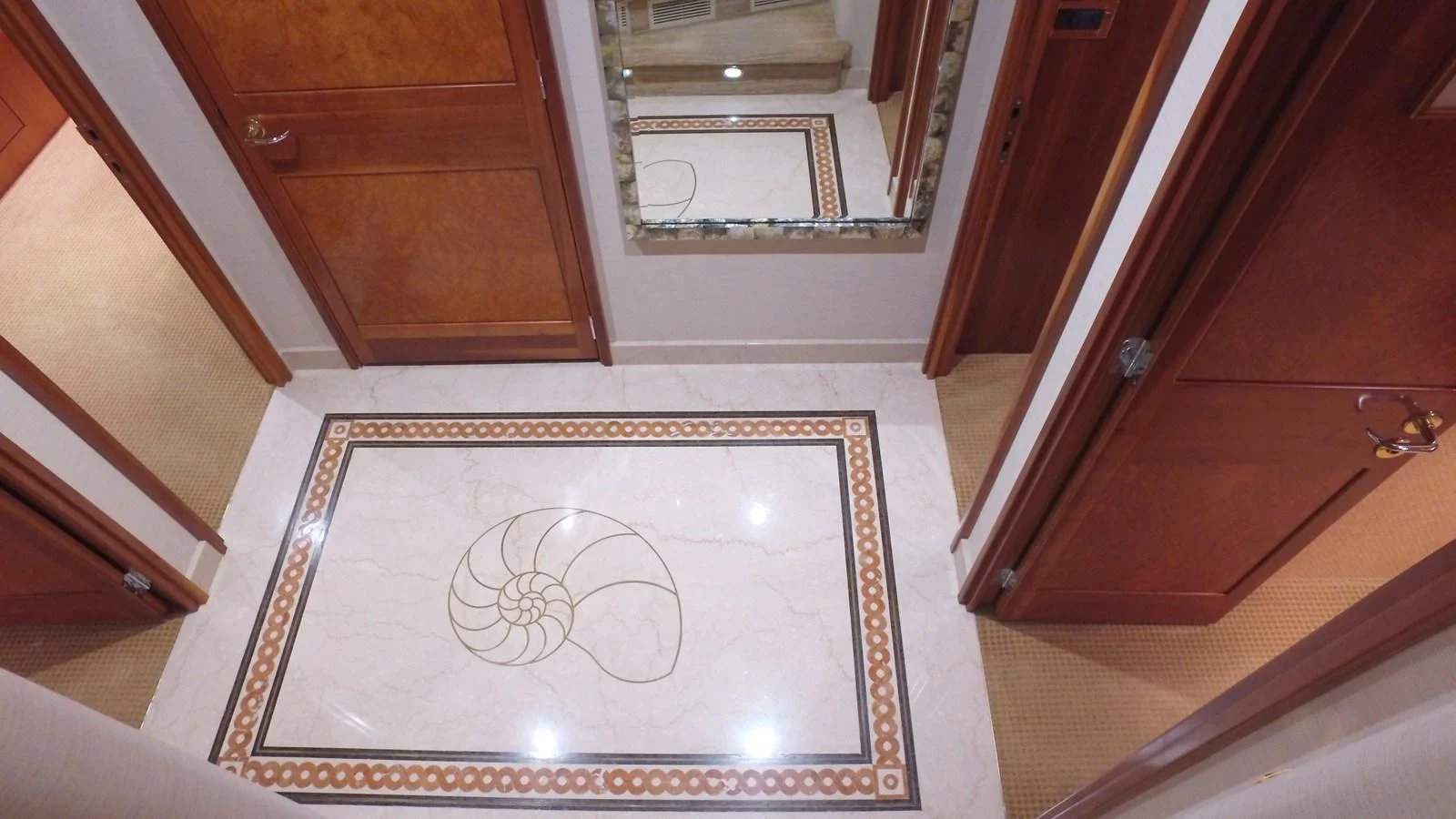 a room with a rug and a mirror aboard ELYSIAN Yacht for Sale