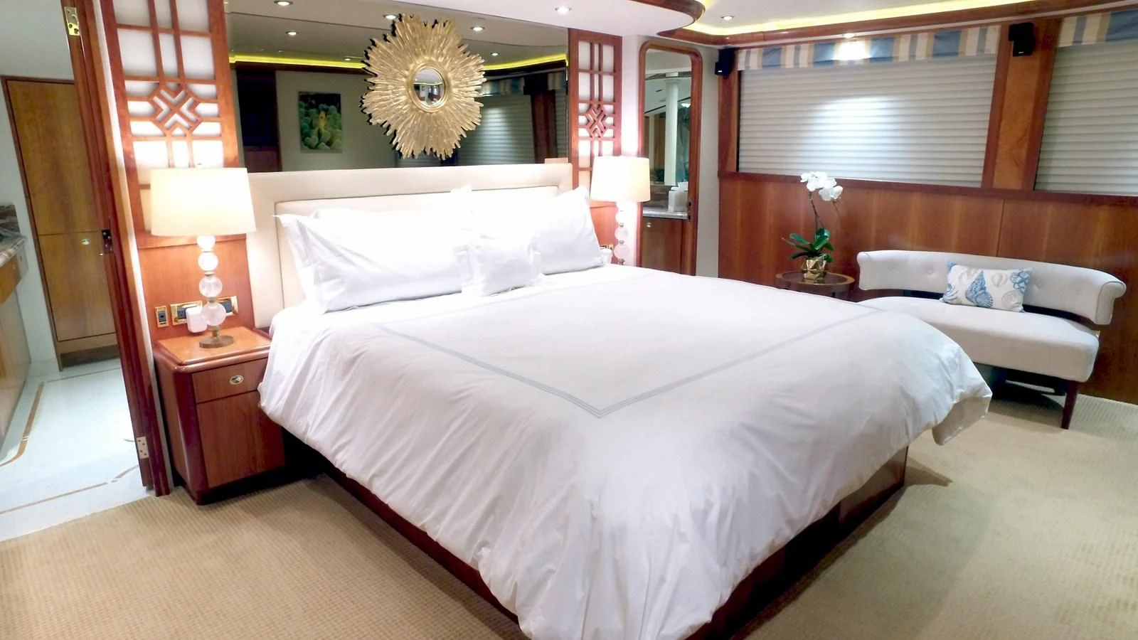 a room with a bed and a desk aboard ELYSIAN Yacht for Sale