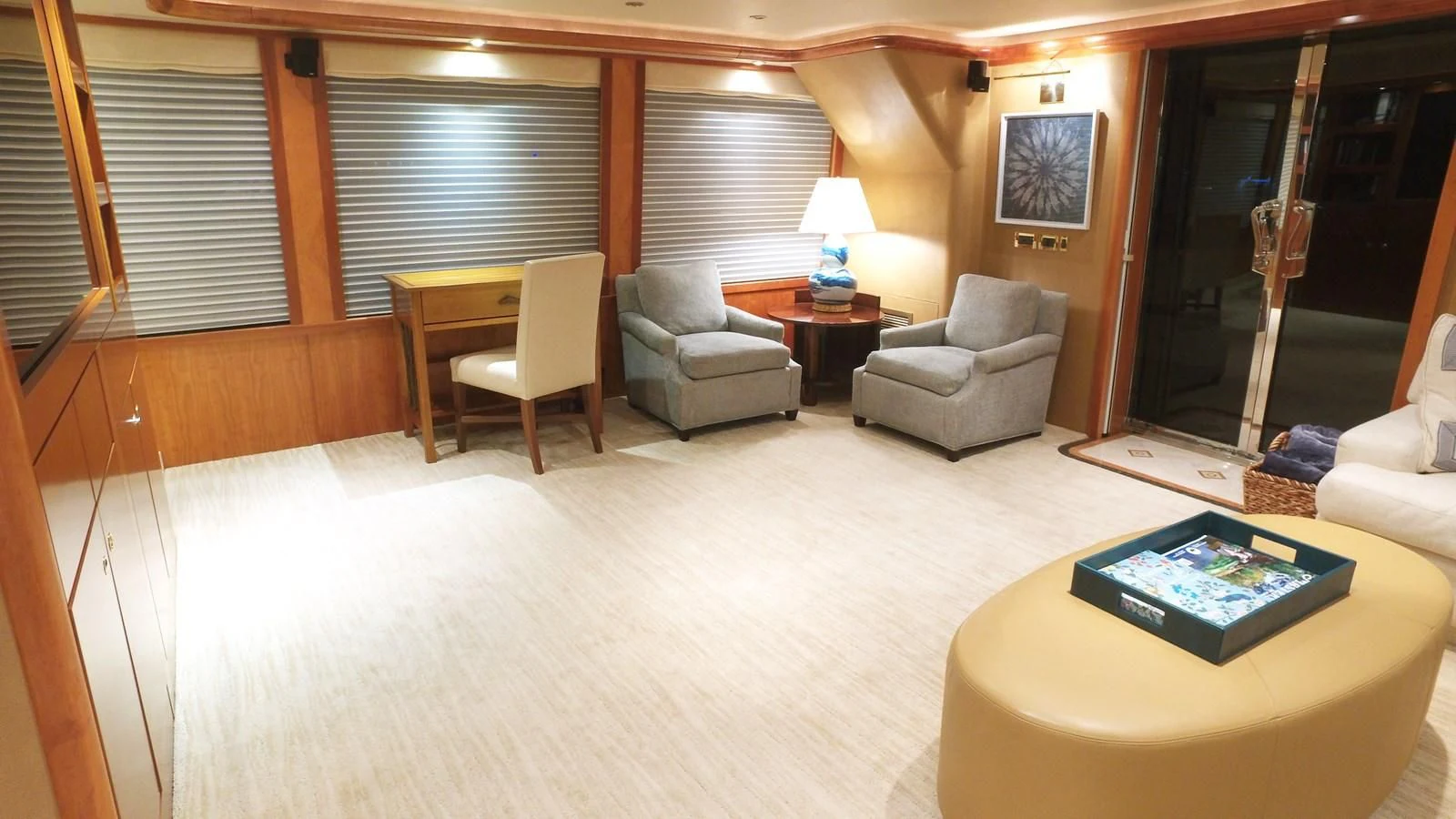 a living room with a large window aboard ELYSIAN Yacht for Sale