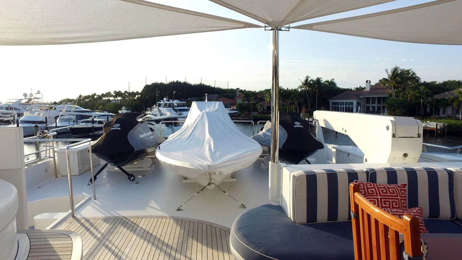 a deck with a table chairs and a large white tent aboard ELYSIAN Yacht for Sale