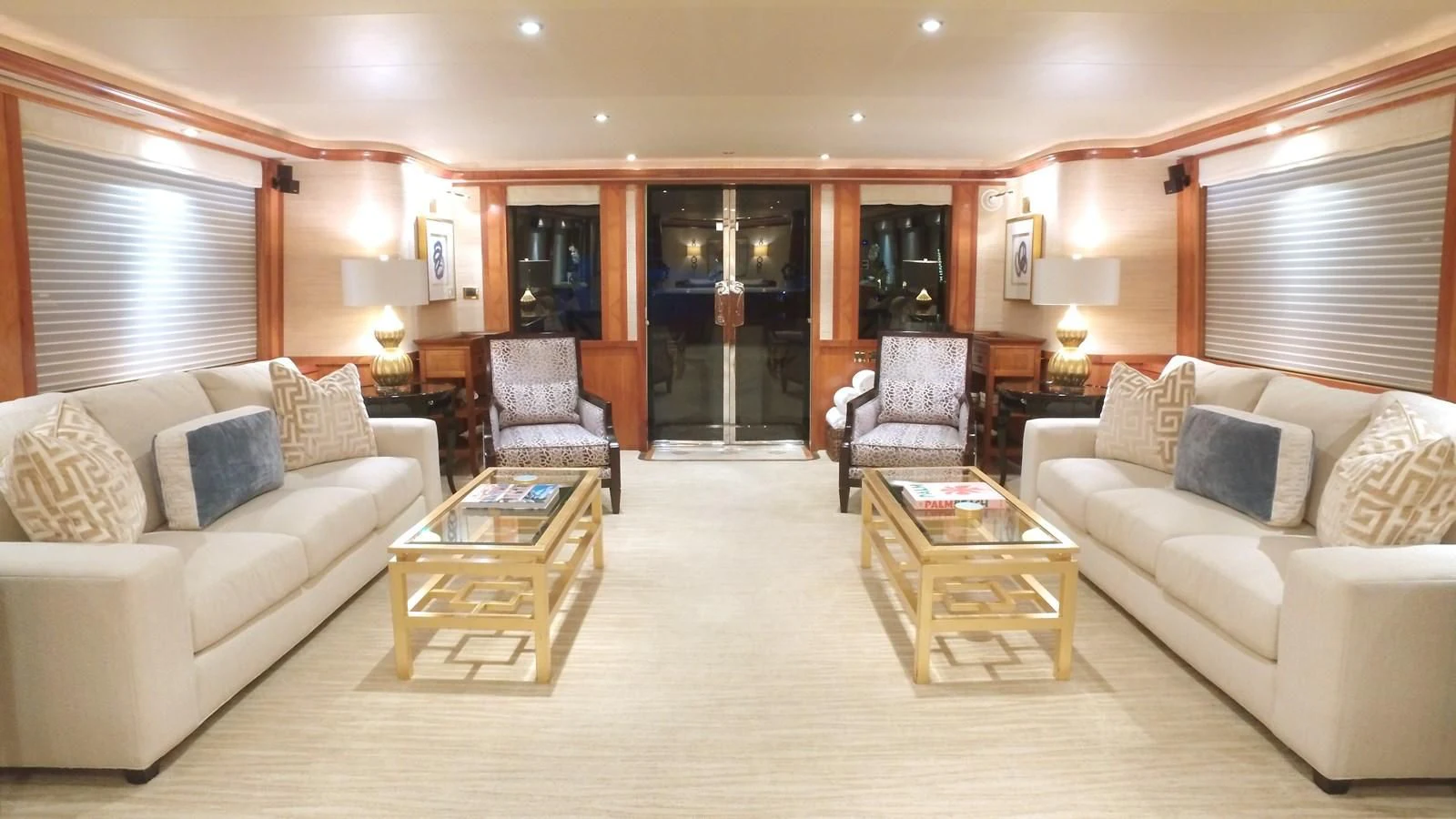 a living room with a couch and a coffee table aboard ELYSIAN Yacht for Sale
